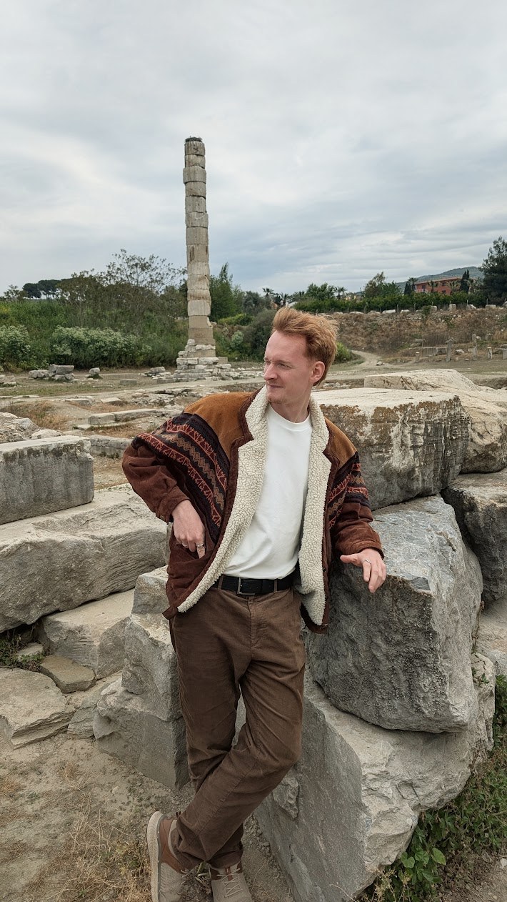 Jacob leaning on fallen marble blocks at Ephesus, with the single standing column of the Temple of Artemis behind him